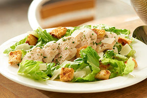smoked chicken caesar , shaved parmesan, cos leaves and garlic croutons